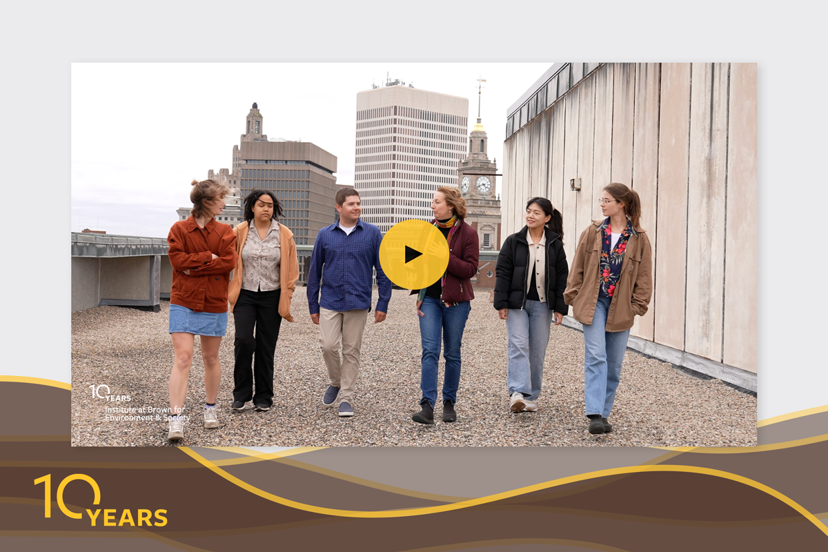 Still from the video showcasing students walking on a building roof.